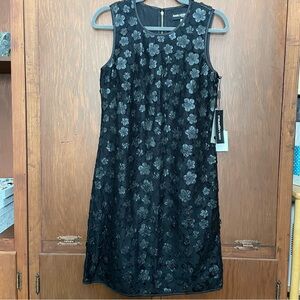 NWT Karl Lagerfeld Paris sleek black cocktail dress with flower accents.